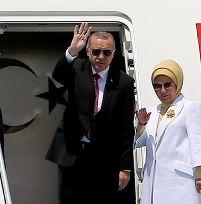 President of Turkey Recep Tayyip Erdogan (C), flanked by his wife Emine Erdogan