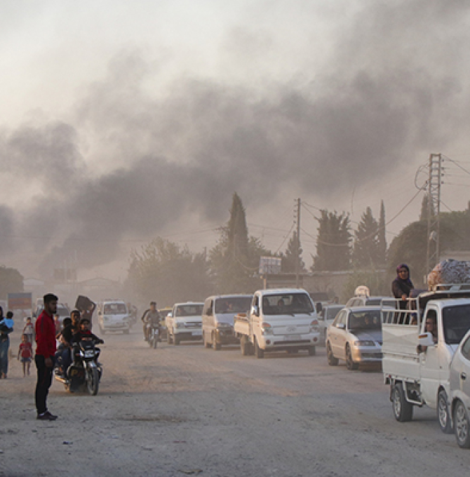 Syrians flee shelling by Turkish forces in Ras al Ayn, northeast Syria,